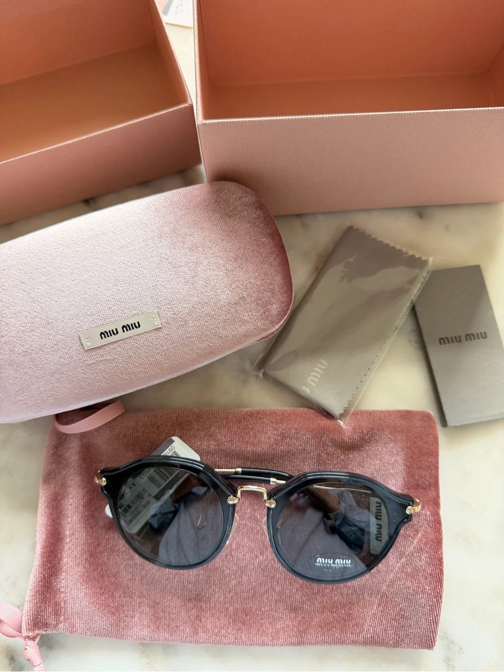 Miu Miu Round Sunglasses